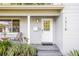 Close-up of a well-maintained front door with stylish details and landscaping at 1518 Cheyenne Ne St, St Petersburg, FL 33703