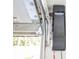 Close-up view of a garage door mechanism featuring a Chamberlain garage door opener at 1518 Cheyenne Ne St, St Petersburg, FL 33703
