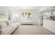 Bright living area with neutral tones, hardwood floors, and an open-concept design at 1518 Cheyenne Ne St, St Petersburg, FL 33703