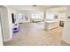 Modern living room showcasing tile floors, neutral furniture, and an open layout at 1518 Cheyenne Ne St, St Petersburg, FL 33703