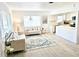 Stylish living room with tile floors, neutral decor, and bright natural light at 1518 Cheyenne Ne St, St Petersburg, FL 33703