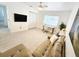 Cozy living room with a sofa, desk, and bright window at 1518 Cheyenne Ne St, St Petersburg, FL 33703