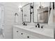 Beautiful bathroom features double sink vanity, modern fixtures, and elegant lighting at 15316 Winding Creek Dr, Tampa, FL 33613