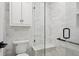 Bathroom shower boasts glass surround, bench, and modern finishes at 15316 Winding Creek Dr, Tampa, FL 33613