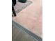 A patio showing the drainage design with pavers, rocks, and wood-look tiles at 15316 Winding Creek Dr, Tampa, FL 33613
