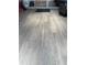 A well kept porch area with wood look flooring at 15316 Winding Creek Dr, Tampa, FL 33613