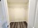 Walk-in closet featuring wood-look floors, and metal shelving at 1565 S Martin Luther King Jr Ave, Clearwater, FL 33756