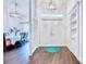 Open entryway featuring beautiful front door, hardwood floors and bright lighting at 1592 Cumberland E Ct, Palm Harbor, FL 34683