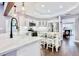 Contemporary kitchen featuring an island with seating, modern fixtures, and stainless appliances at 1592 Cumberland E Ct, Palm Harbor, FL 34683