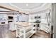 Well-equipped kitchen featuring an island, stainless appliances, and an open design at 1592 Cumberland E Ct, Palm Harbor, FL 34683
