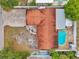 Aerial view of the property shows a pool, brick patio, and privacy fence at 1710 Townsend St, Clearwater, FL 33755