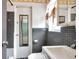 Bathroom featuring a vanity, toilet, and tiled walls at 1710 Townsend St, Clearwater, FL 33755