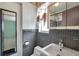 Bathroom featuring a vanity, toilet, and tiled walls at 1710 Townsend St, Clearwater, FL 33755