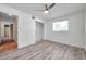 Bright bedroom featuring wood-look flooring, a ceiling fan, and closet at 1710 Townsend St, Clearwater, FL 33755