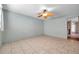 Large bedroom featuring tile floors and a ceiling fan at 1710 Townsend St, Clearwater, FL 33755