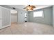 Bedroom with tiled floors, large window, and walk-in closet at 1710 Townsend St, Clearwater, FL 33755