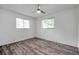 Bedroom showcasing new floors, neutral walls, and bright windows at 1710 Townsend St, Clearwater, FL 33755
