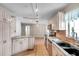 Bright kitchen featuring stainless steel appliances, granite countertops and breakfast bar at 1710 Townsend St, Clearwater, FL 33755
