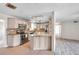 Bright kitchen featuring stainless steel appliances, granite countertops and island at 1710 Townsend St, Clearwater, FL 33755