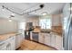 Bright kitchen featuring stainless steel appliances, granite countertops and breakfast bar at 1710 Townsend St, Clearwater, FL 33755