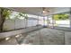 Enclosed lanai featuring a ceiling fan and decorative rug at 1710 Townsend St, Clearwater, FL 33755