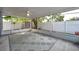 The enclosed lanai features a ceiling fan and a view of the backyard at 1710 Townsend St, Clearwater, FL 33755