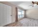 Living room showing large front door, ceiling fan, and large window with lots of natural light at 1710 Townsend St, Clearwater, FL 33755