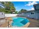 Refreshing in-ground pool surrounded by a well-maintained deck, offering a private backyard oasis for relaxation and recreation at 1710 Townsend St, Clearwater, FL 33755