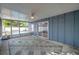 Relaxing screened-in porch with a ceiling fan and views of the pool and backyard, ideal for outdoor living at 1710 Townsend St, Clearwater, FL 33755