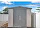 Exterior shot of a neutral colored outdoor storage shed on the property at 1710 Townsend St, Clearwater, FL 33755