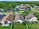 Aerial view of a single Gathering home highlighting the fenced-in backyard at 18419 Merseyside Loop, Land O Lakes, FL 34638