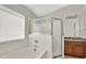 Well-lit bathroom with a tub, enclosed shower, and a stylish vanity area at 18419 Merseyside Loop, Land O Lakes, FL 34638