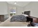 Comfortable bedroom with backyard view, contemporary furniture, and neutral wall color at 18419 Merseyside Loop, Land O Lakes, FL 34638