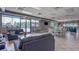 View of clubhouse with comfortable seating areas, tables, and large windows providing natural light at 18419 Merseyside Loop, Land O Lakes, FL 34638
