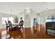 Elegant dining area with hardwood floors, vaulted ceilings, and contemporary décor at 18419 Merseyside Loop, Land O Lakes, FL 34638
