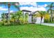 Lush landscaping frames this well-maintained single Gathering home with a two car garage at 18419 Merseyside Loop, Land O Lakes, FL 34638