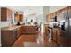 Well-equipped kitchen with stainless steel appliances, oak cabinets, and granite countertops at 18419 Merseyside Loop, Land O Lakes, FL 34638