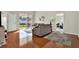 Living room with hardwood floors, sliding glass doors, neutral colors, and modern furnishings at 18419 Merseyside Loop, Land O Lakes, FL 34638