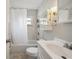 Well-lit bathroom featuring a shower over tub, vanity, and medicine cabinet at 2140 Bow Ln, Safety Harbor, FL 34695