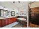 Contemporary bathroom features double sinks, tiled shower, and large soaking tub at 2140 Bow Ln, Safety Harbor, FL 34695