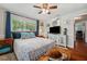Bright bedroom featuring hardwood floors, a comfortable bed, and turtle-themed decor for a unique touch at 2140 Bow Ln, Safety Harbor, FL 34695