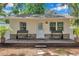 Charming detached structure with a covered front porch and stone accents at 2140 Bow Ln, Safety Harbor, FL 34695