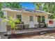 Charming detached structure with a covered front porch and stone accents at 2140 Bow Ln, Safety Harbor, FL 34695