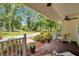 Welcoming front porch with ample space for seating and greenery, offering a serene outdoor area at 2140 Bow Ln, Safety Harbor, FL 34695