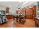 Spacious kitchen with abundant dark wood cabinetry, granite countertops, and large island with seating at 2140 Bow Ln, Safety Harbor, FL 34695