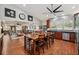 Open-concept kitchen flowing into a living area, featuring a large island and dark wood cabinetry at 2140 Bow Ln, Safety Harbor, FL 34695