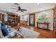 Cozy living room with hardwood floors, a decorative cabinet, and a welcoming ambiance at 2140 Bow Ln, Safety Harbor, FL 34695