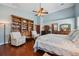 Comfortable bedroom with hardwood floors, vaulted ceilings, and a light blue color scheme at 2140 Bow Ln, Safety Harbor, FL 34695