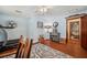 Bright office space with hardwood floors and a view to the bathroom and back through the house at 2140 Bow Ln, Safety Harbor, FL 34695