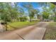 Large property with a sprawling lawn, mature trees, and circular drive; mailbox visible in the image at 2140 Bow Ln, Safety Harbor, FL 34695